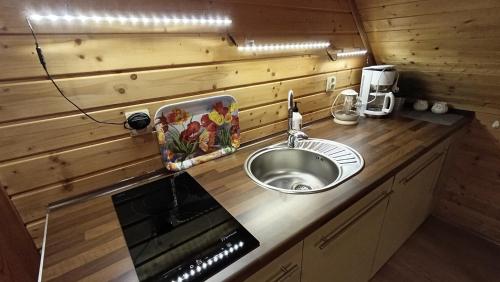 a kitchen with a sink and a counter top at Wiślany Raj in Wisła