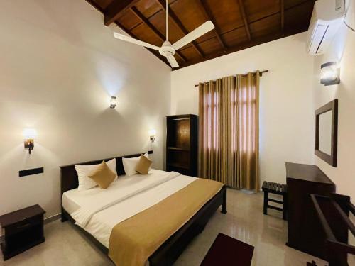 a bedroom with a large bed in a room at SKY Heaven in Weligama