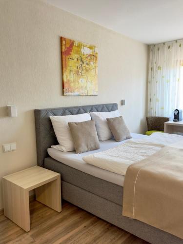 a bedroom with a large bed with at Gasthaus Wollscheid in Trier