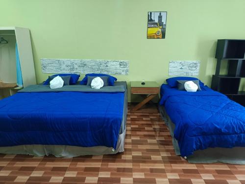 Postel nebo postele na pokoji v ubytování Mirra Mirzas Roomstay