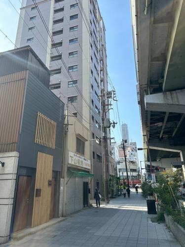 Spacious 40 Square Meter Suite with Separate Living Room and Bedroom Japanese Modern Style JR and Osaka Metro Access Near Kyocera Dome USJ