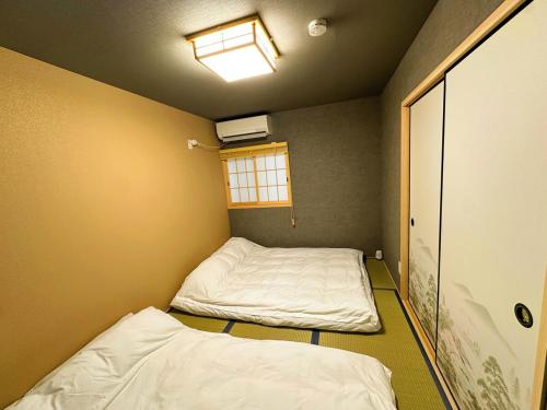 Spacious 40 Square Meter Suite with Separate Living Room and Bedroom Japanese Modern Style JR and Osaka Metro Access Near Kyocera Dome USJ
