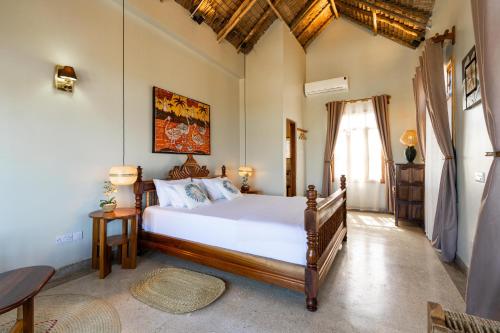 a bedroom with a large bed in a room at Villa Fika in Dar es Salaam