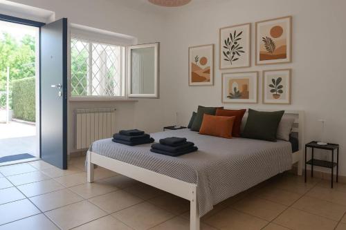 Ένα ή περισσότερα κρεβάτια σε δωμάτιο στο Idyllium Roma Suite