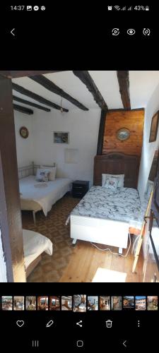 a room with two beds in a room at Etno kuca Petrovic in Štrpce