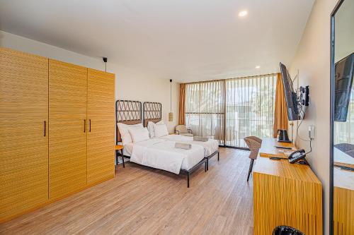 Ένα ή περισσότερα κρεβάτια σε δωμάτιο στο Kombo Oasis