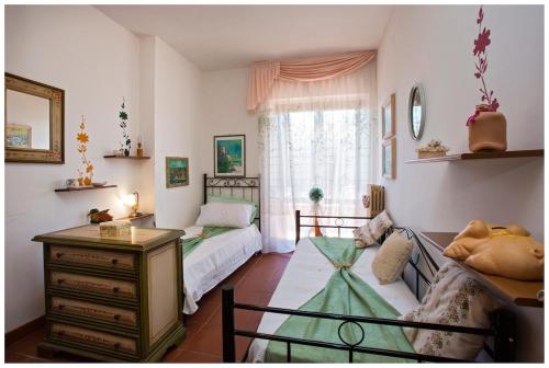 Ένα ή περισσότερα κρεβάτια σε δωμάτιο στο Villa Ariete