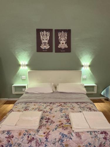 Ένα ή περισσότερα κρεβάτια σε δωμάτιο στο Il Cortiletto di Ortigia