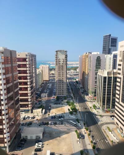 an aerial view of a city with tall buildings at DIGITAL OUMMAH RESIDENCEs 01 TCA in Abu Dhabi