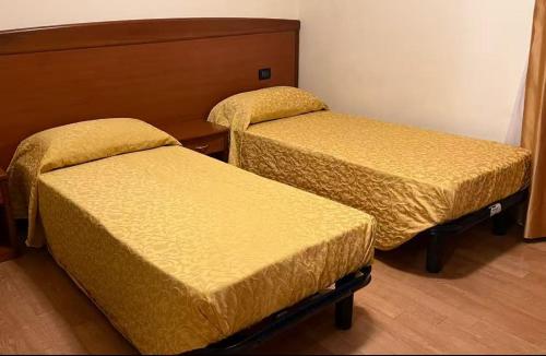 Ένα ή περισσότερα κρεβάτια σε δωμάτιο στο Ristorante Albergo Wada