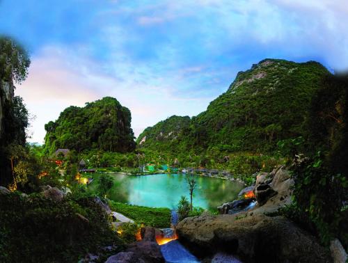 a view of a lake surrounded by mountains at The Banjaran Hotsprings Retreat in Ipoh