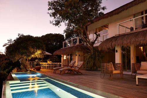 a house with a swimming pool in front of a house at Spectacular view overlooking the famous Boracay white beach ! in Boracay