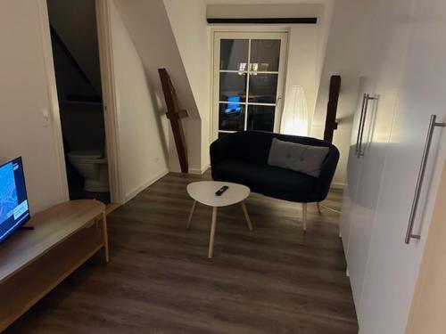 a living room with a couch and a table at 11F 2 th in Vejle