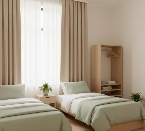 Giường trong phòng chung tại Siera Luxury Hotel