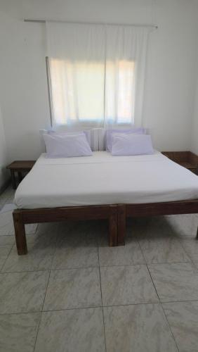 Ένα ή περισσότερα κρεβάτια σε δωμάτιο στο Carol's Home