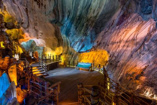 a room in a cave with a bed in it at The Banjaran Hotsprings Retreat in Ipoh