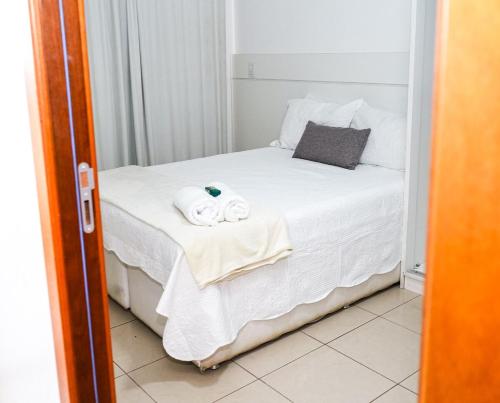 En eller flere senge i et værelse på Life Resort - Temporada