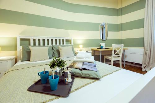 a bedroom with a bed with a tray on it at CasaViva - Bilo in Camogli with Parking & Shared Pool in Camogli