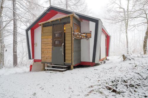 a small cabin in the woods in the snow at Hoi Hoi in Rankoshi