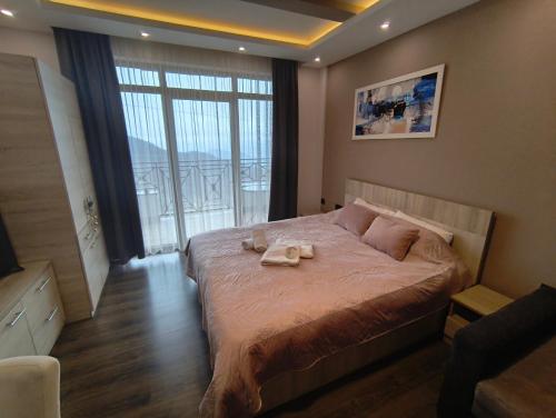 Ένα ή περισσότερα κρεβάτια σε δωμάτιο στο Milmari M9