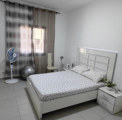 Ένα ή περισσότερα κρεβάτια σε δωμάτιο στο Chambre Meublée