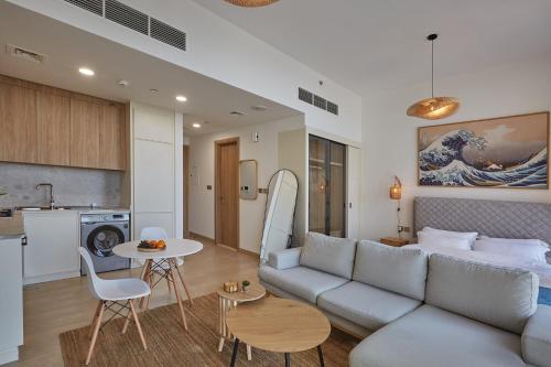 a living room with a couch and a table at Casa Haven Retreat in Dubai