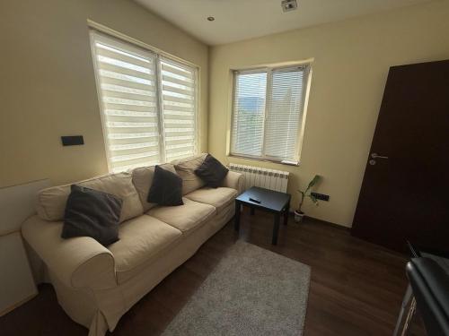a living room with a couch and a table at Pasarel House in Pasarel