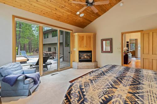 a bedroom with a king sized bed and a fireplace at Glaze Meadow 376 in Black Butte Ranch