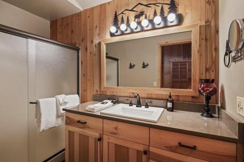 a bathroom with a sink and a mirror at 14 Mt Hood in Sunriver