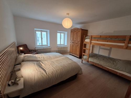 a bedroom with two bunk beds and a lamp at La Casa di Elvira-Primo Piano in Piaia