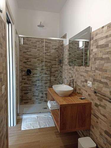 a bathroom with a sink and a shower at Ciccone's Rooms in Larino