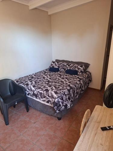 Ένα ή περισσότερα κρεβάτια σε δωμάτιο στο MDA Myburgh