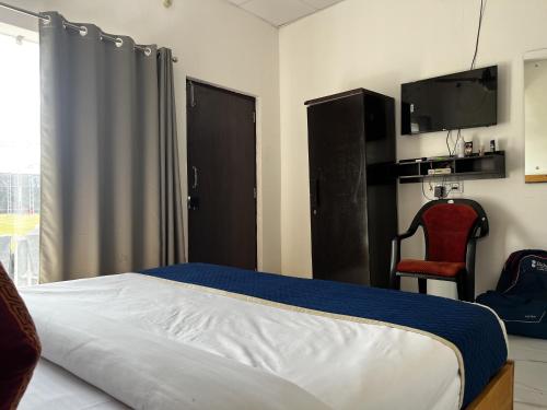 Un pat sau paturi într-o cameră la The Corbett Niyas