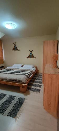 Postel nebo postele na pokoji v ubytování Casa AyA Colibita