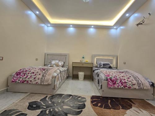 Postel nebo postele na pokoji v ubytování SR Grand House