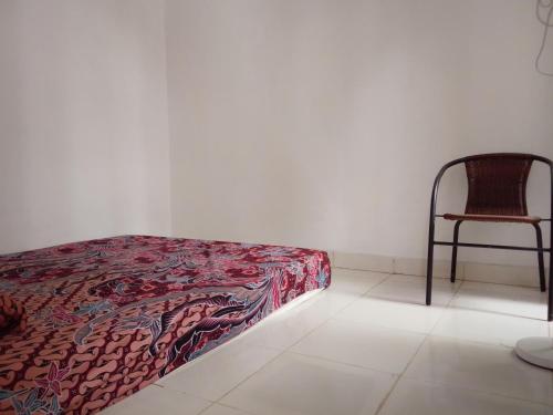 Postel nebo postele na pokoji v ubytování Homestay Tata