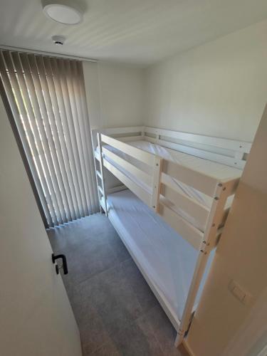 Una cama o camas en una habitación de Samen Aan Zee