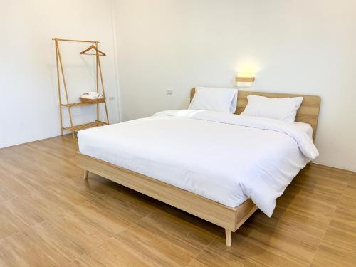 Ένα ή περισσότερα κρεβάτια σε δωμάτιο στο Nakai Resort Sakon Nakhon