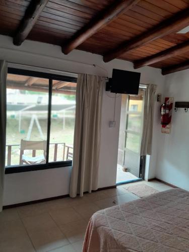 Ένα ή περισσότερα κρεβάτια σε δωμάτιο στο Cabañas La Bahia Escondida