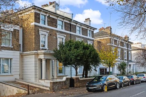 a black car parked in front of a house at The Regents Park Townhouse in London