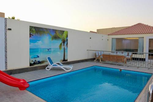 Bazén v ubytování شالبهات اللمسة المخملية nebo v jeho okolí