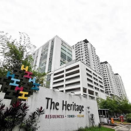 a sign in front of some tall buildings at Heritage cando in Seri Kembangan