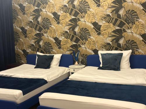 Un pat sau paturi într-o cameră la Iridam De-Luxe