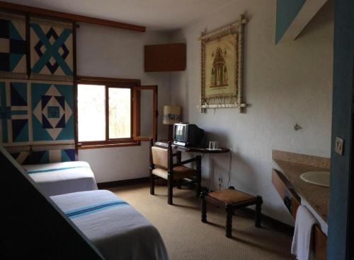 Ένα ή περισσότερα κρεβάτια σε δωμάτιο στο Tana hotel