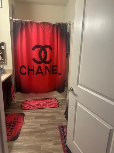 a bathroom with a chinese shower curtain and a door at Southside 3bed 2Ba Spacious Comfy Home in Fort Worth