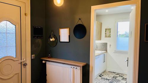a kitchen with a sink and a counter in a room at L'Escale de Pontcarré - Disneyland Paris in Pontcarré