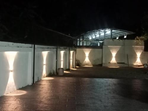 a building at night with lights on the wall at KODIVEED Heritage in Alleppey