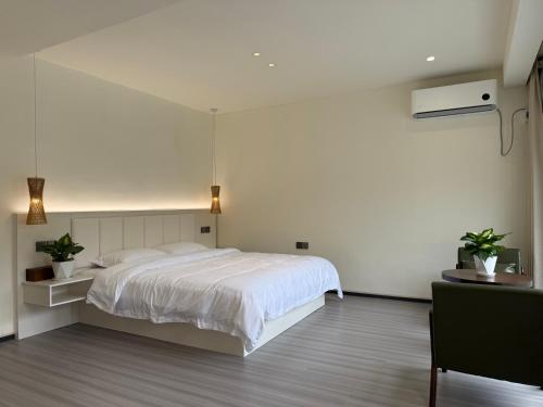 Postel nebo postele na pokoji v ubytování Twilight Homestay