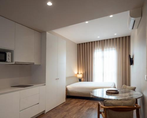 Ein Bett oder Betten in einem Zimmer der Unterkunft Foz Apartments