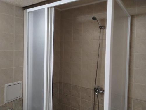 a shower with a glass door in a bathroom at hotel Sofia in Bansko